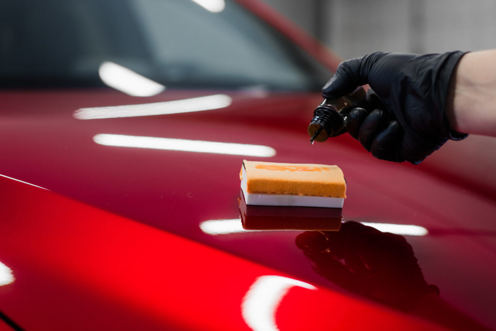 car-detailing-man-applies-nano-protective-coating--VFMU5MK